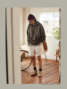 USAGE Faded Vintage Wash Hoodie in Olive - On Male Model