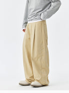 MEDM Embroidered Cotton Cargo Pants in Beige - On Model