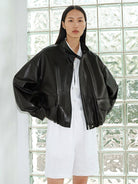 MSBEAST Oil Waxed Sheepskin Stand Collar Jacket in Black - On Female Model
