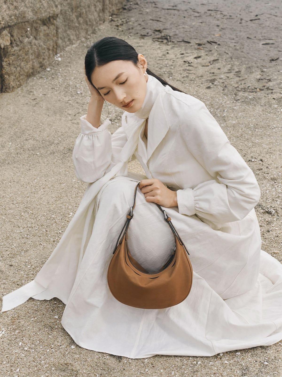 QIUZHEN Vegetable Tanned Leather Crescent Bag in Beige - On Female Model