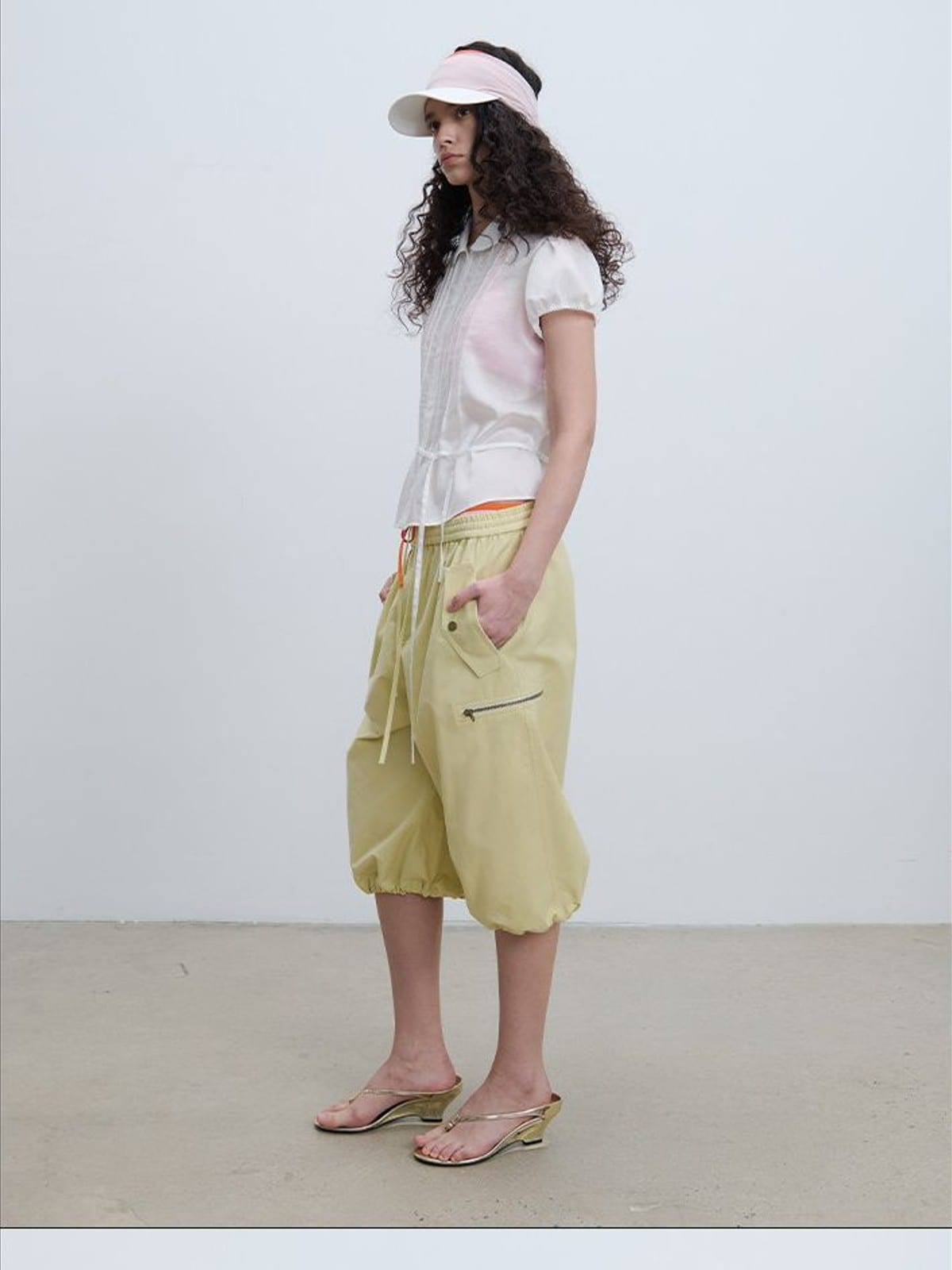 RARELY ALIKE Cropped Cotton Lantern Cargo Shorts in Beige - On Female Model