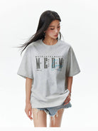 MEDM Vintage Logo Typography Cotton T Shirt in Heather Gray - On Female Model