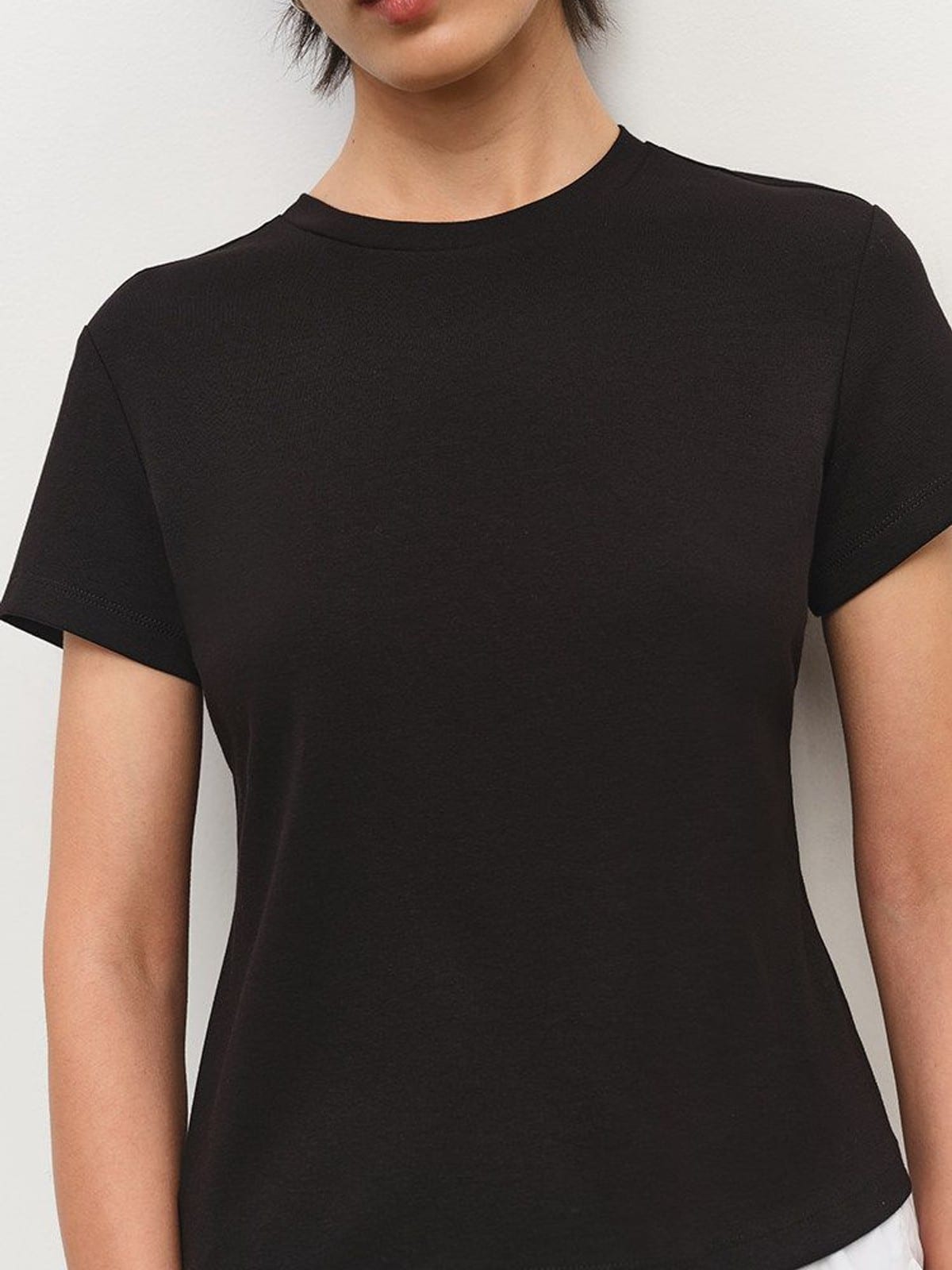 MSBEAST Cotton Blend Tapered Waist T Shirt in Black - On Female Model