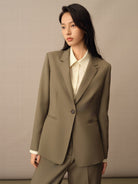TEASEL Merino Wool Pleated Trousers in Olive - On Female Model