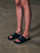 SMFK Leather Cross Detail Slide Sandals in Black - On Female Model