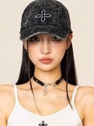 SMFK Distressed Cross Embroidered Baseball Cap in Black - On Female Model