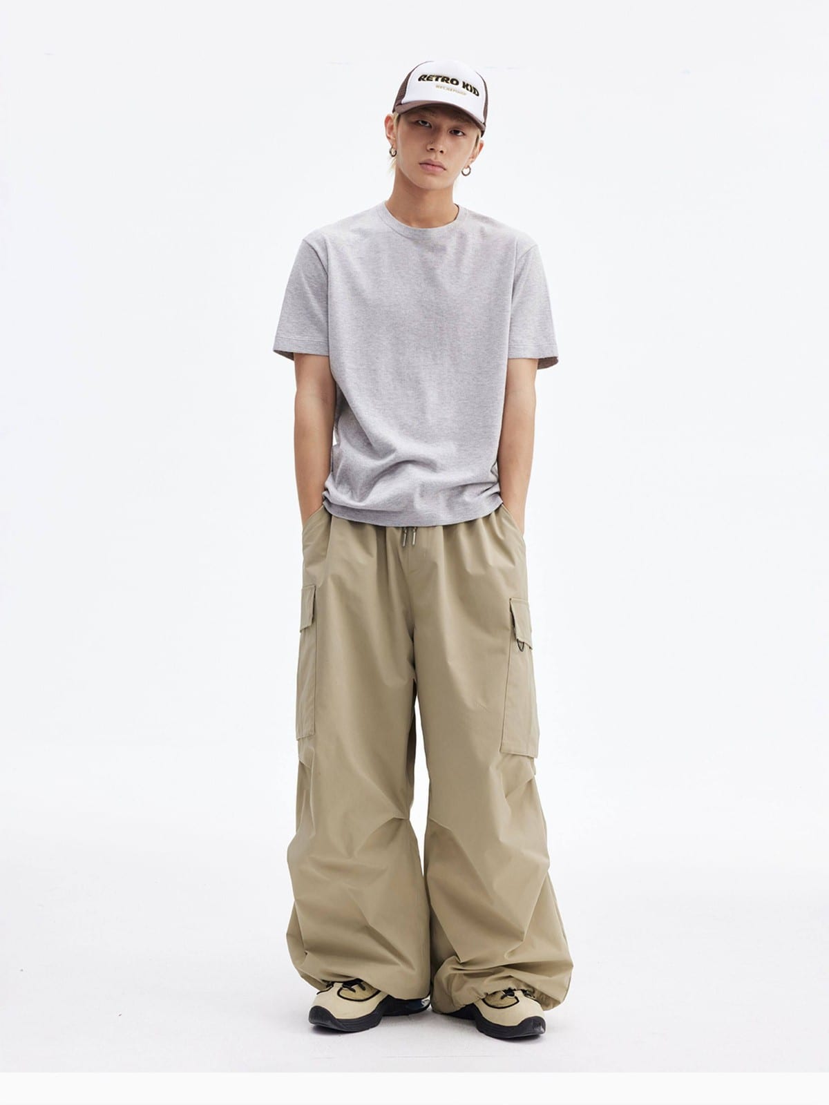 MEDM Multi Pocket Parachute Cargo Pants in Beige - On Male Model
