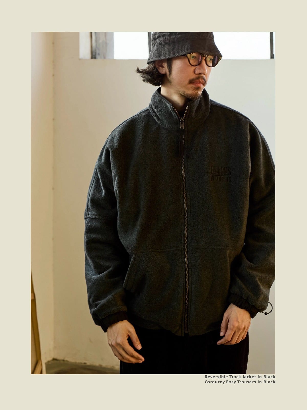 USAGE Reversible Nylon Fleece Track Jacket in Black - On Male Model