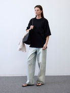 Random Piece Cotton Drop Shoulder T Shirt in Black - On Female Model