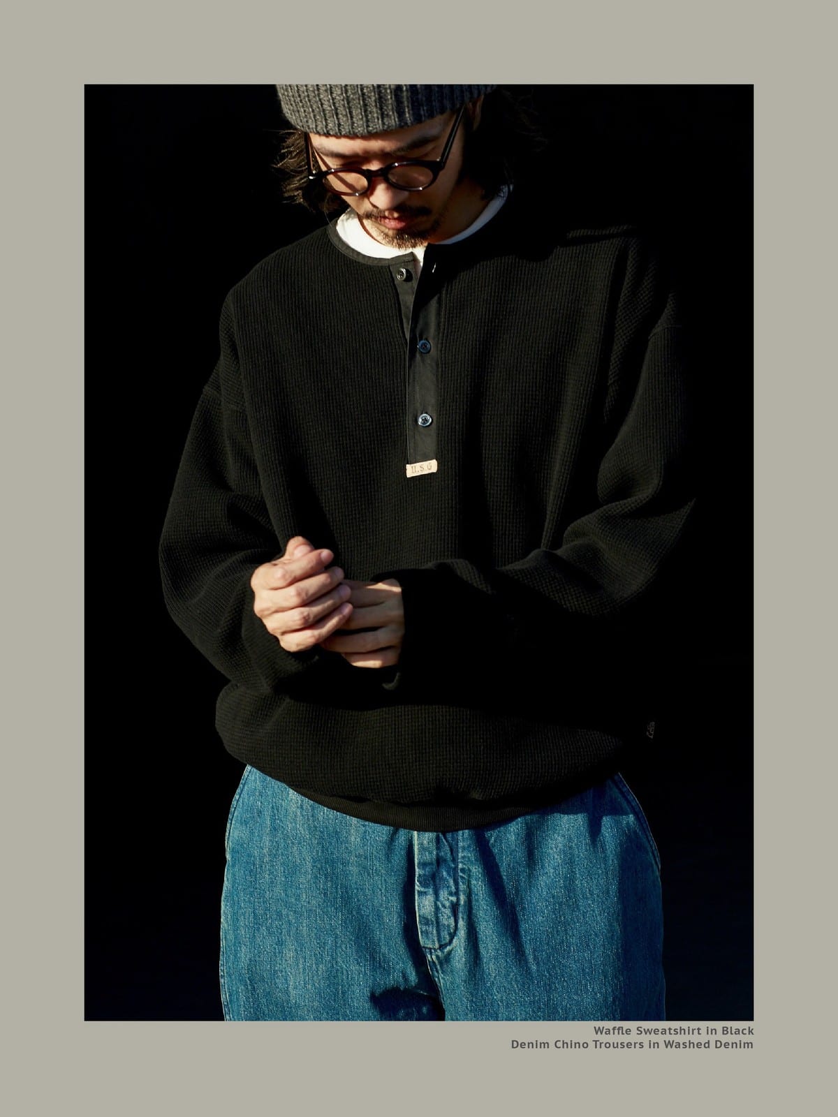 USAGE Heavyweight Waffle Knit Henley Sweatshirt in Black - On Male Model
