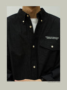 USAGE Oversized Micro Check Button Down Shirt in Black - On Male Model