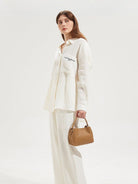 HONGU Cowhide Crossbody Bucket Bag in Taupe - On Female Model