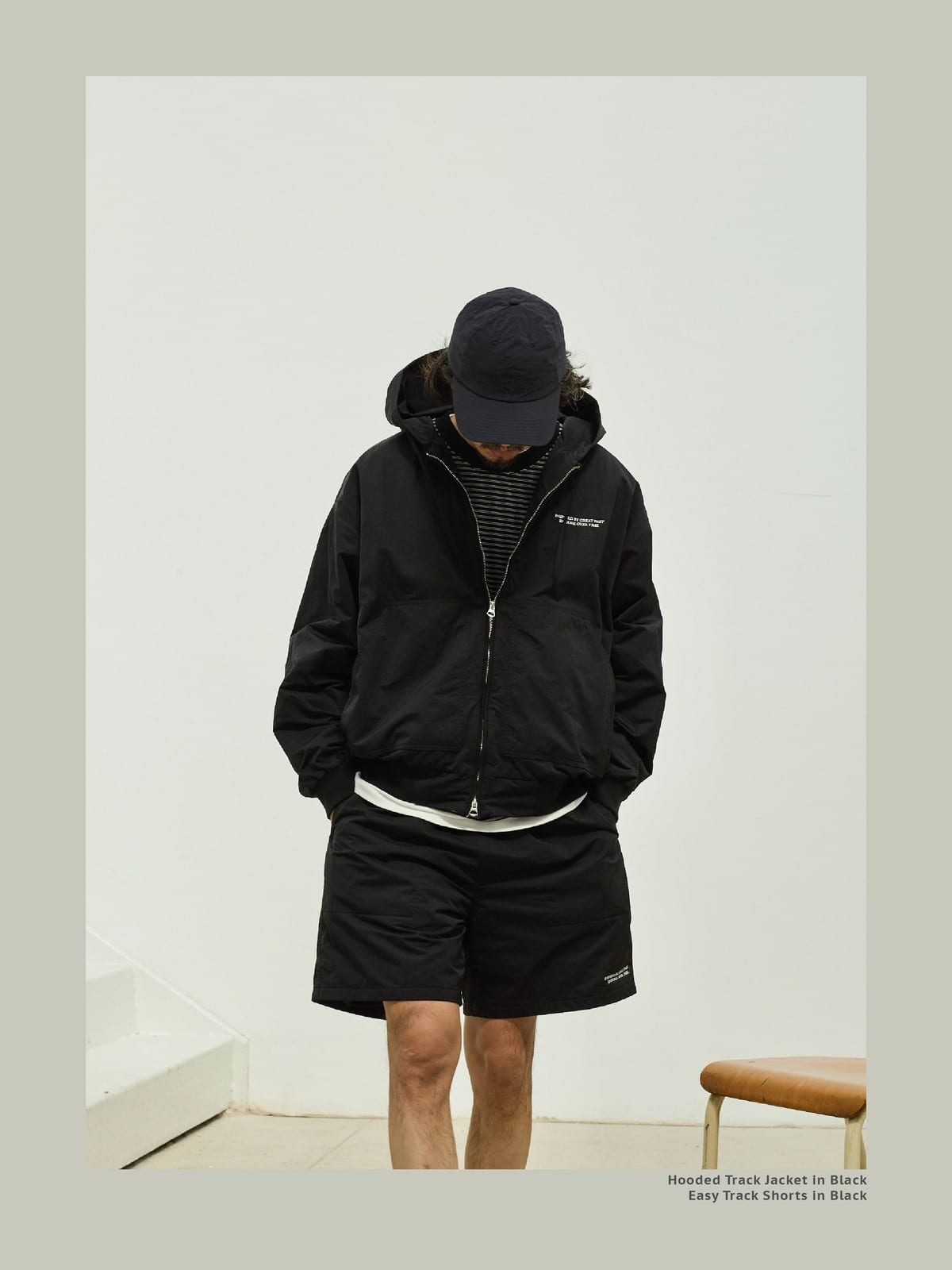 USAGE Crinkle Nylon Hooded Track Jacket in Black - On Male Model