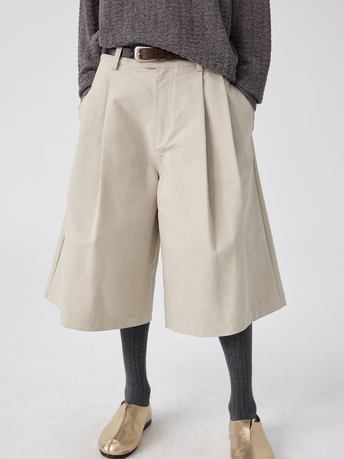 SIMPLE PROJECT Cotton Pleated Cropped Shorts in Beige - On Model