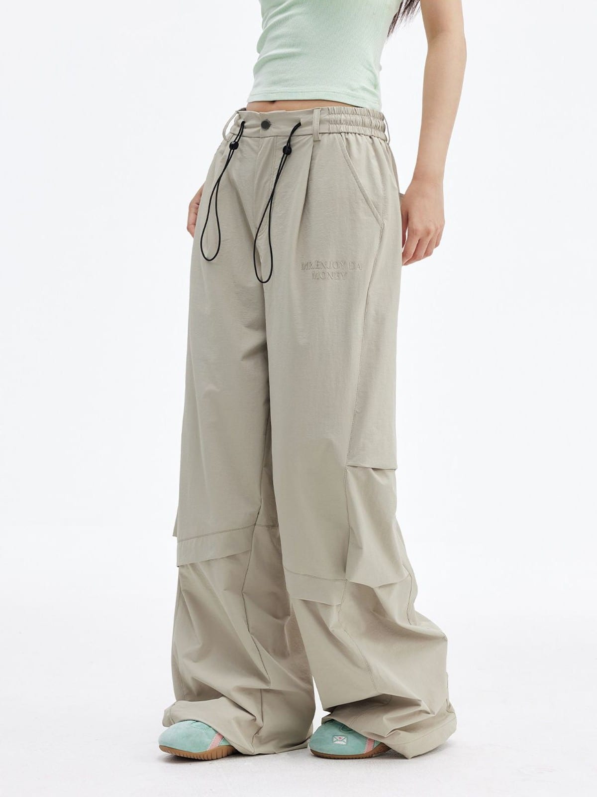 MEDM Crinkled Nylon Parachute Cargo Pants in Beige - On Female Model