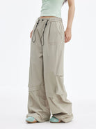 MEDM Crinkled Nylon Parachute Cargo Pants in Beige - On Female Model