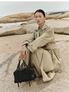 QIUZHEN Vegetable Tanned Kidskin Bowling Bag in Black - On Female Model