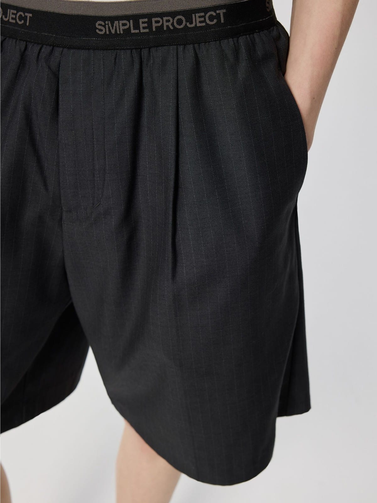 SIMPLE PROJECT Logo Tape Wool Blend Shorts in Gray - On Model
