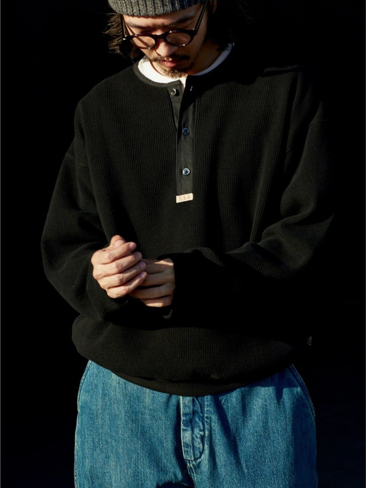 USAGE Heavyweight Waffle Knit Henley Sweatshirt in Black - On Male Model