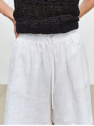 MSBEAST 100 Linen Knee Length Shorts in White - On Model