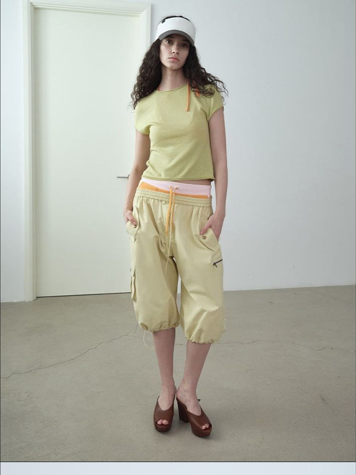 RARELY ALIKE Cropped Cotton Lantern Cargo Shorts in Beige - On Female Model