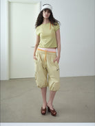 RARELY ALIKE Cropped Cotton Lantern Cargo Shorts in Beige - On Female Model
