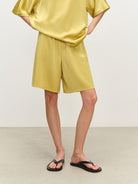 MSBEAST Oversized Acetate Satin T Shirt in Yellow - On Female Model