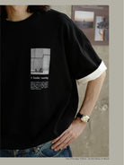 USAGE Air Spun Cotton Graphic T Shirt in Black - On Male Model
