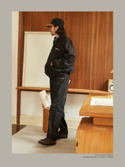 USAGE Heavily Washed Selvedge Denim Jeans in Black - On Male Model