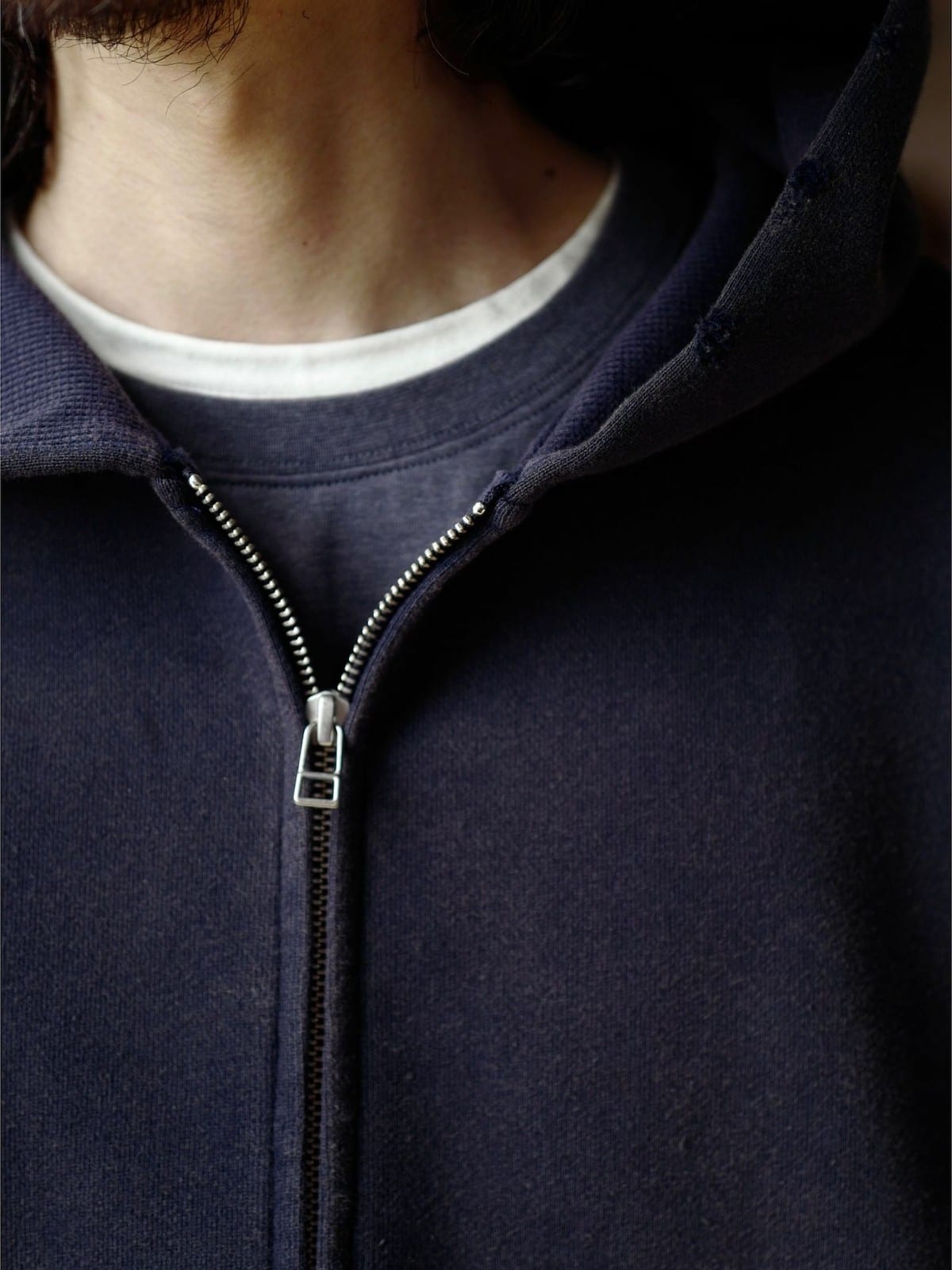 USAGE Hand Distressed Washed Zip Hoodie in Navy Blue - On Male Model
