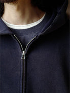 USAGE Hand Distressed Washed Zip Hoodie in Navy Blue - On Male Model