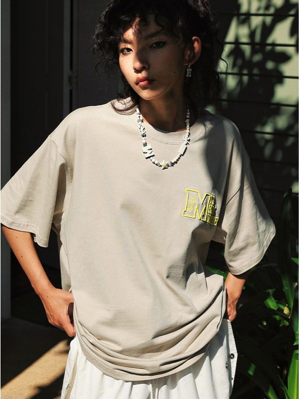 MEDM Half Sleeve Cotton Logo T Shirt in Beige - On Female Model