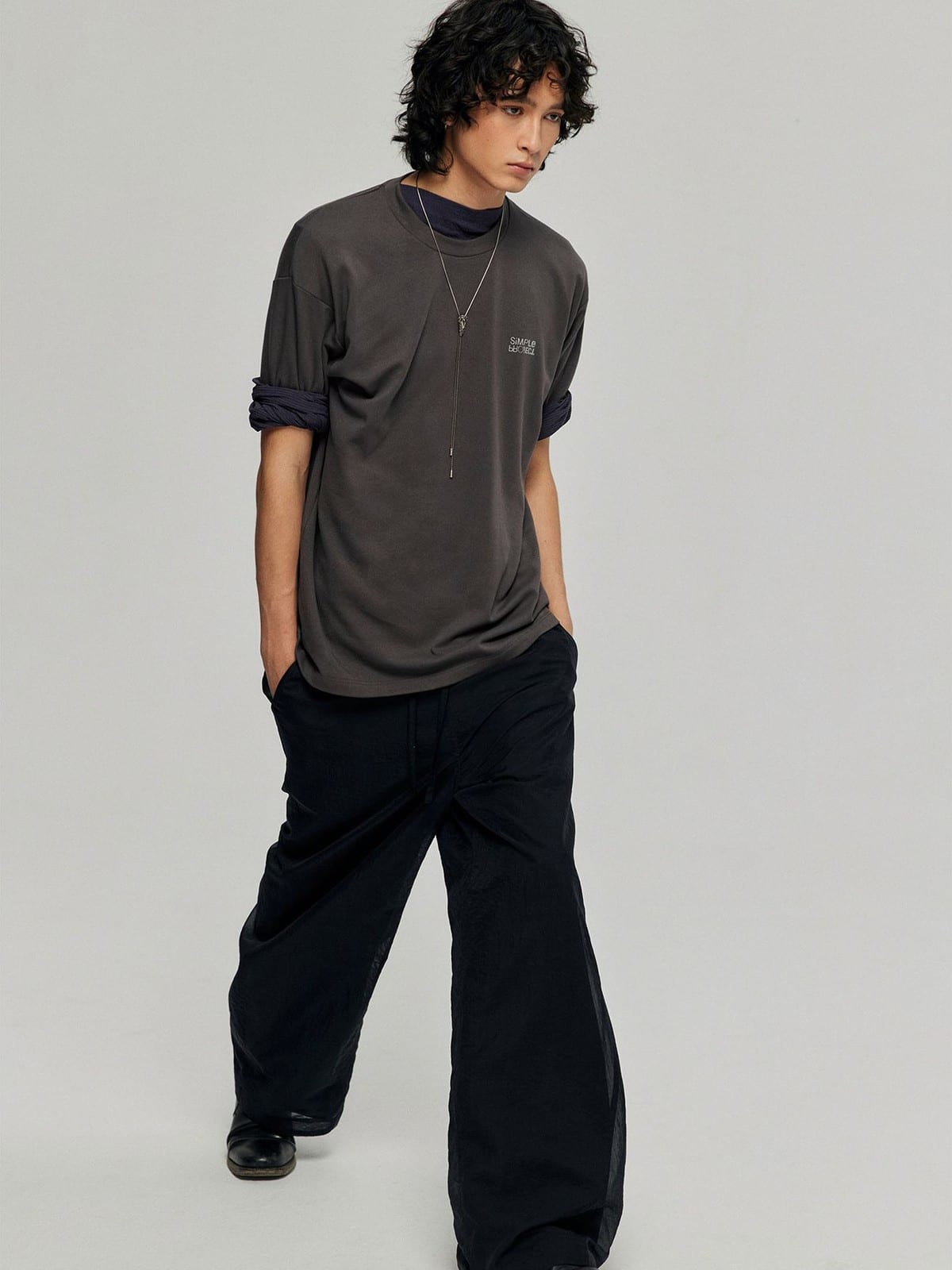 SIMPLE PROJECT Inverted Silver Logo Crewneck T Shirt in Charcoal - On Male Model