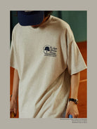 USAGE Retro Tennis Graphic Cotton T Shirt in Gray - On Male Model