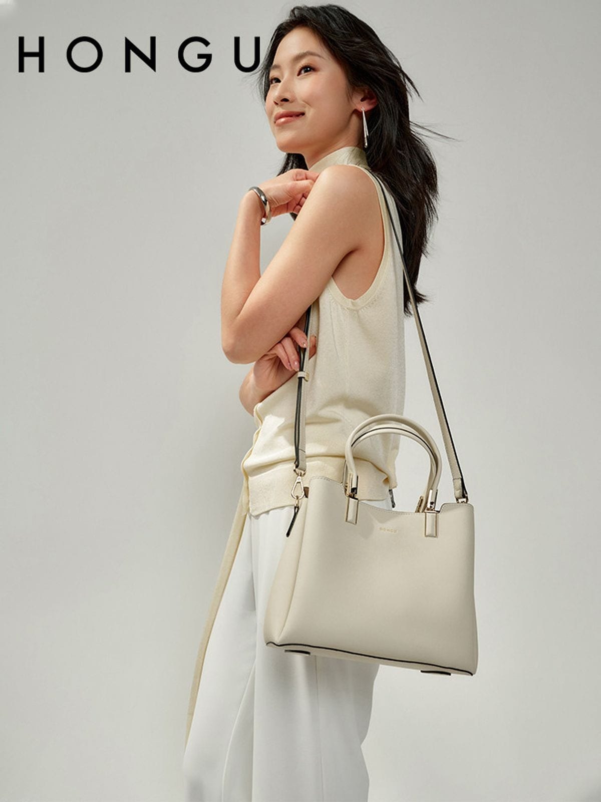 HONGU Split Cowhide Crossbody Handbag in White - On Female Model