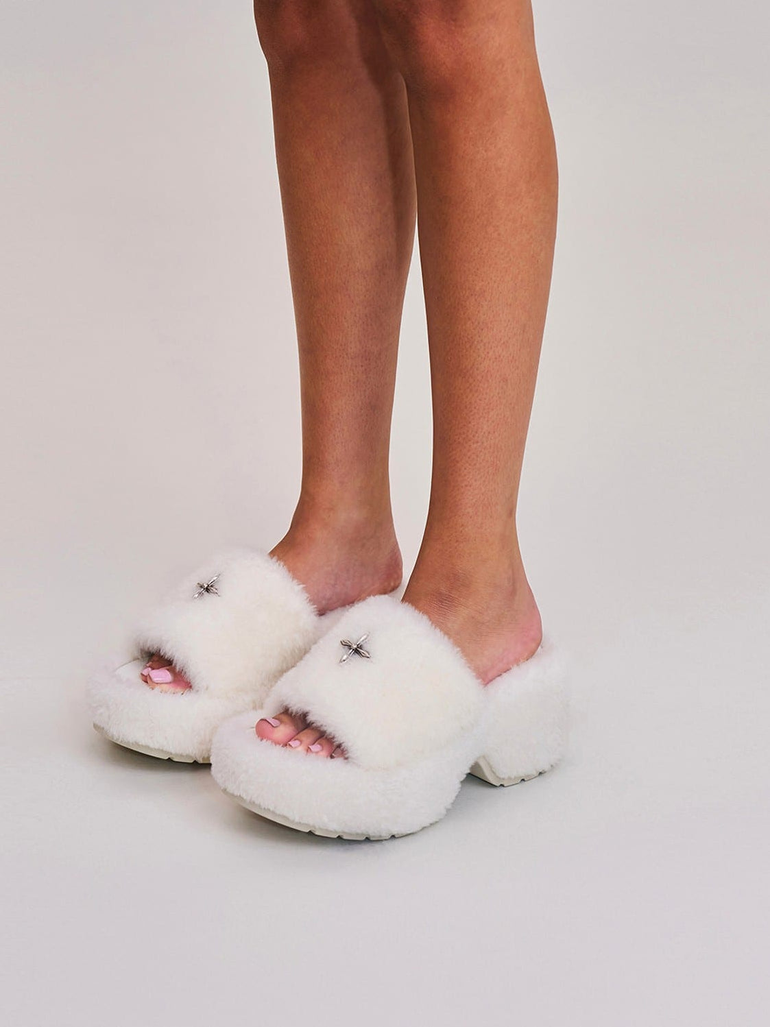 SMFK Cross Hardware Shearling High Heel Mules in White - On Female Model