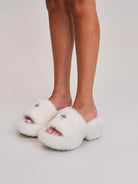 SMFK Cross Hardware Shearling High Heel Mules in White - On Female Model