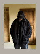 USAGE Washed Cotton Twill M65 Jacket in Black - On Male Model