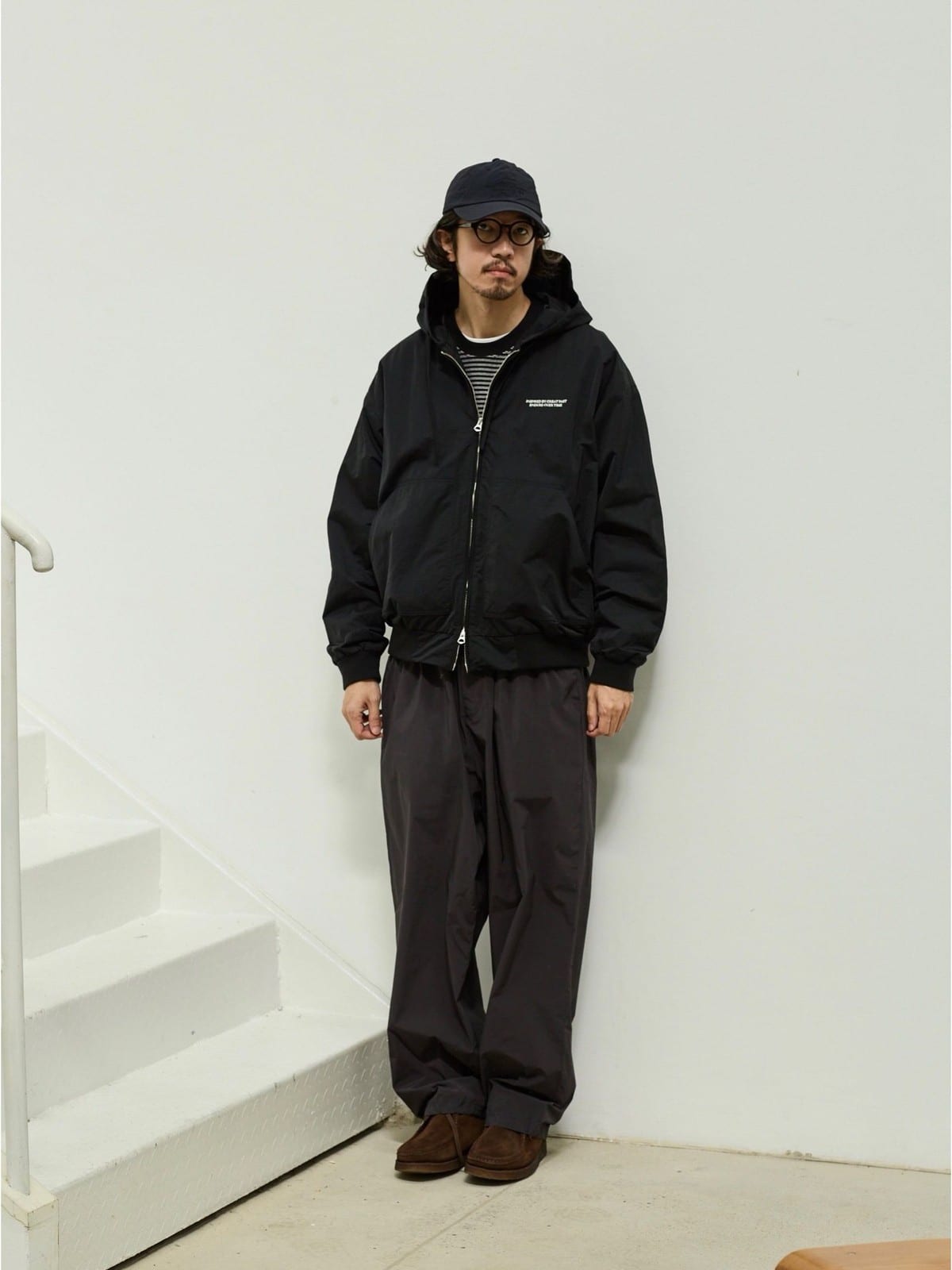 USAGE Crinkle Nylon Hooded Track Jacket in Black - On Male Model