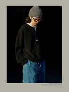 USAGE Heavyweight Waffle Knit Henley Sweatshirt in Black - On Male Model