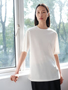 MSBEAST Oversized Lyocell Wool Blend T Shirt in White - On Female Model