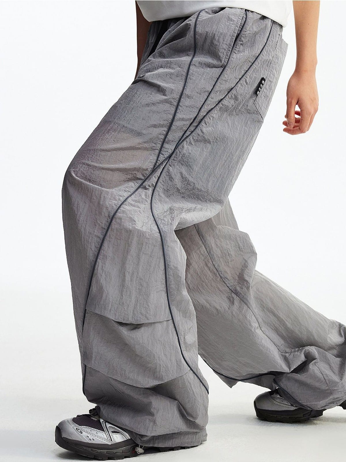 MEDM Glossy Piped Techwear Track Pants in Light Gray - On Model