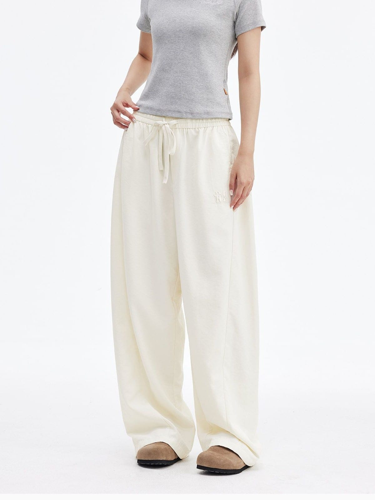 MEDM Lightweight Wide Leg Track Pants in White - On Female Model