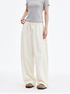 MEDM Lightweight Wide Leg Track Pants in White - On Female Model