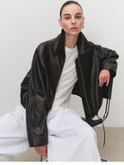MSBEAST Cropped Leather Drawstring Jacket in Black - On Female Model