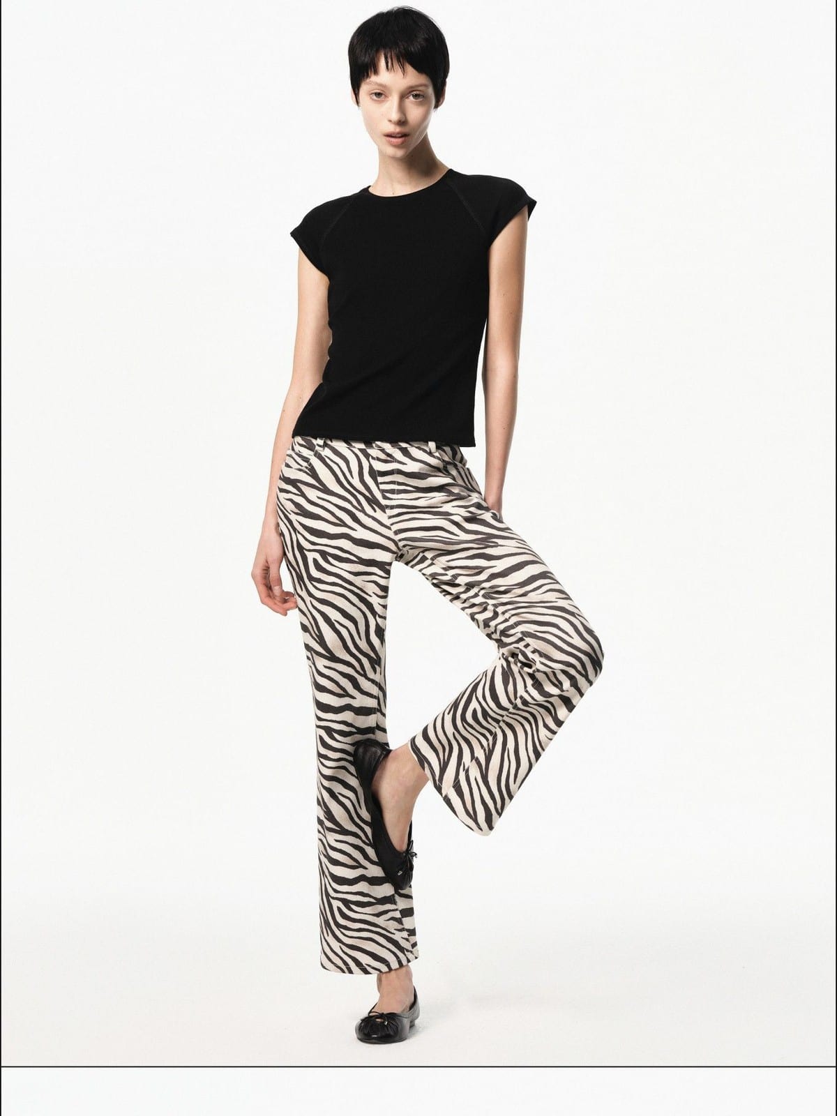 RARELY ALIKE Raglan Cap Sleeve T Shirt in Black - On Female Model