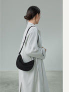 QIUZHEN Vegetable Tanned Leather Crescent Bag in Black - On Female Model