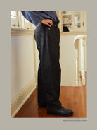 USAGE Heavily Washed Selvedge Denim Jeans in Black - On Model