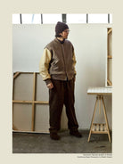 USAGE Reversible Velvet Leather Varsity Jacket in Beige - On Male Model
