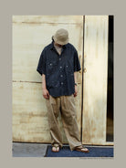 USAGE Distressed Short Sleeve Denim Shirt in Gray - On Male Model